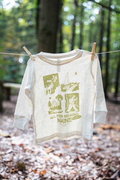 toddler t-shirt clipped with clothespins on a line outdoors